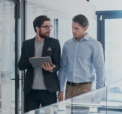 Two individuals discussing work
