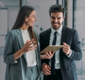 Man and woman looking at tablet